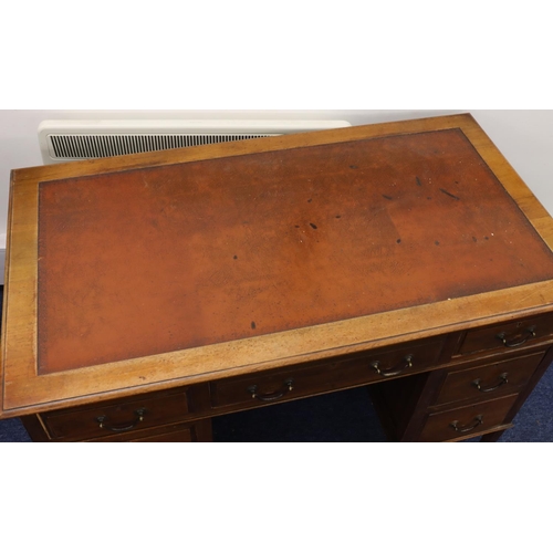 936 - A 1930's mahogany kneehole double pedestal desk with brown leather inset top, centre drop flanked by... 