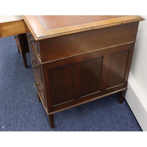 936 - A 1930's mahogany kneehole double pedestal desk with brown leather inset top, centre drop flanked by... 