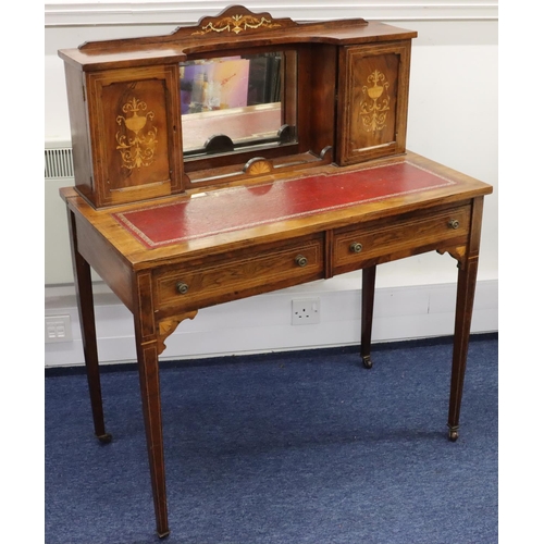 943 - A Victorian rosewood ladies' writing desk with allover inlaid vase, floral and scroll decoration and... 