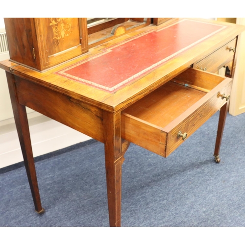 943 - A Victorian rosewood ladies' writing desk with allover inlaid vase, floral and scroll decoration and... 