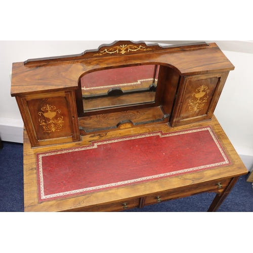 943 - A Victorian rosewood ladies' writing desk with allover inlaid vase, floral and scroll decoration and... 