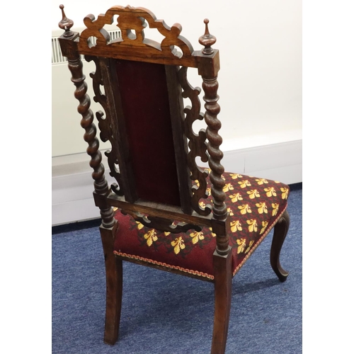 944 - A Victorian walnut nursing chair with barley twist and scroll back, overstuffed seat and part panell... 