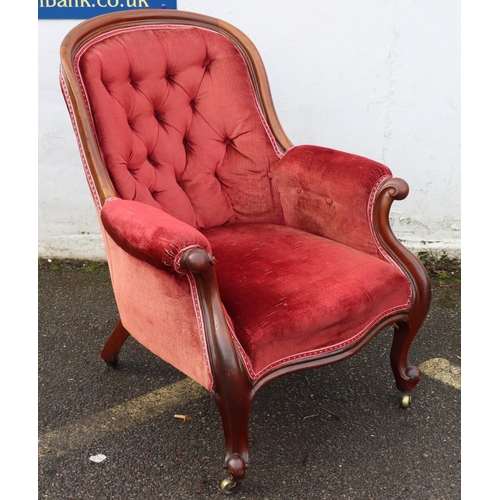 947 - A 19th Century mahogany tub armchair with red velvet overstuffed seat, button back and padded arms o... 