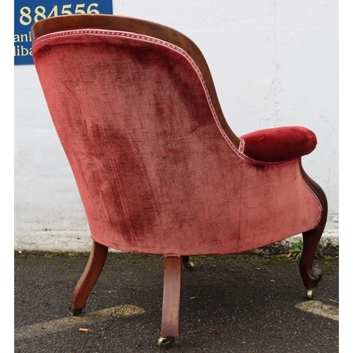 947 - A 19th Century mahogany tub armchair with red velvet overstuffed seat, button back and padded arms o... 