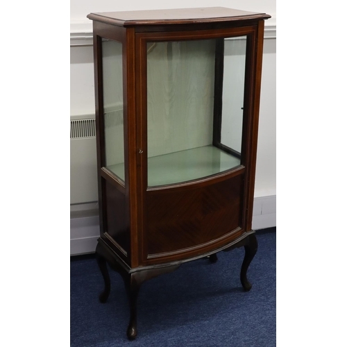 945 - A 1930's mahogany bow fronted low display cabinet with inlaid stringing, bowed glass panel door with... 