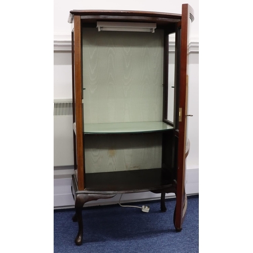 945 - A 1930's mahogany bow fronted low display cabinet with inlaid stringing, bowed glass panel door with... 