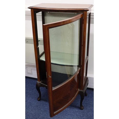 945 - A 1930's mahogany bow fronted low display cabinet with inlaid stringing, bowed glass panel door with... 