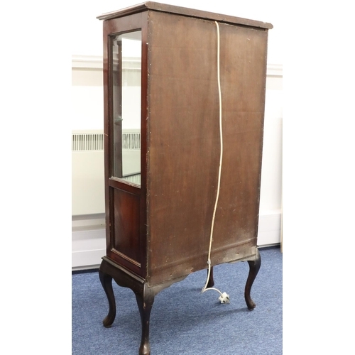 945 - A 1930's mahogany bow fronted low display cabinet with inlaid stringing, bowed glass panel door with... 