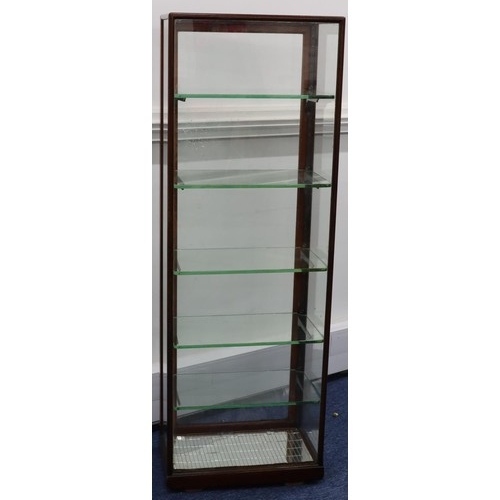 939 - A Victorian mahogany shop cabinet with single glass panelled door, sides and front enclosing adjusta... 