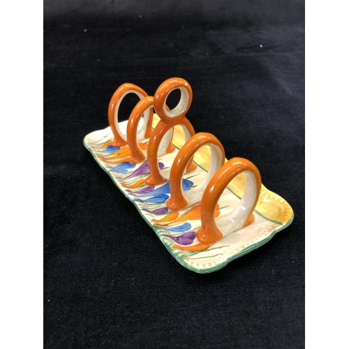 148 - A Clarice Cliff Bazaar crocus pattern rectangular shaped 5-bar toast rack with centre carrying handl... 