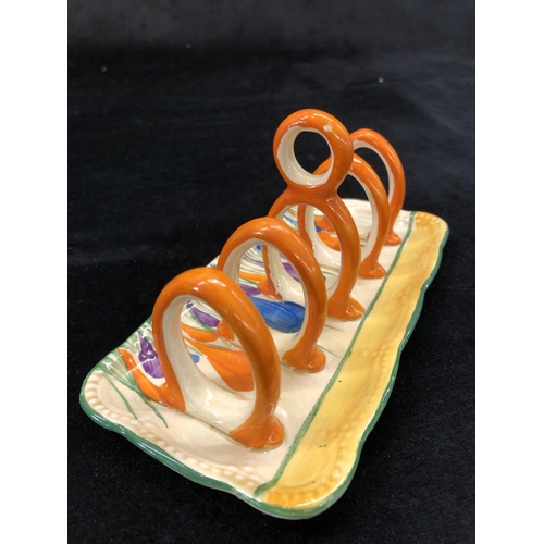 148 - A Clarice Cliff Bazaar crocus pattern rectangular shaped 5-bar toast rack with centre carrying handl... 