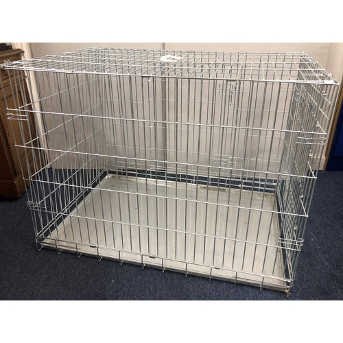 2027 - A modern metallic folding large dog cage with base tray, 107cm wide, 73cm deep, 80cm high. This Lot ... 