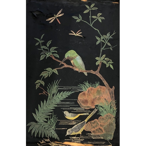 2077 - A painted black fabric picture of birds and trees, 51.5cm x 77cm in gilt frame with brass handle to ... 