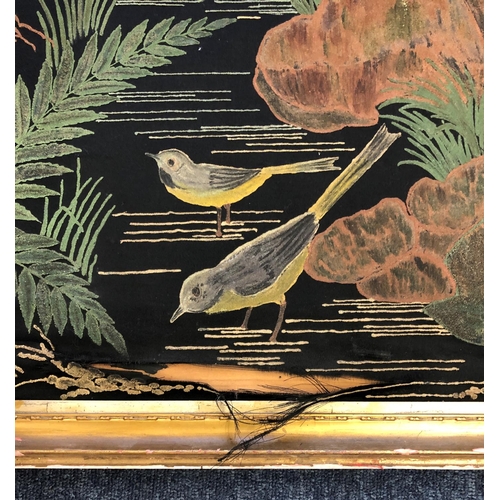 2077 - A painted black fabric picture of birds and trees, 51.5cm x 77cm in gilt frame with brass handle to ... 