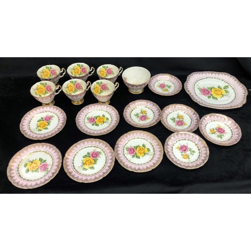 2084 - An Imperial rose patterned bone china part service, 6 cups, 5 saucers, sugar bowl, 5 side plates, 1 ... 