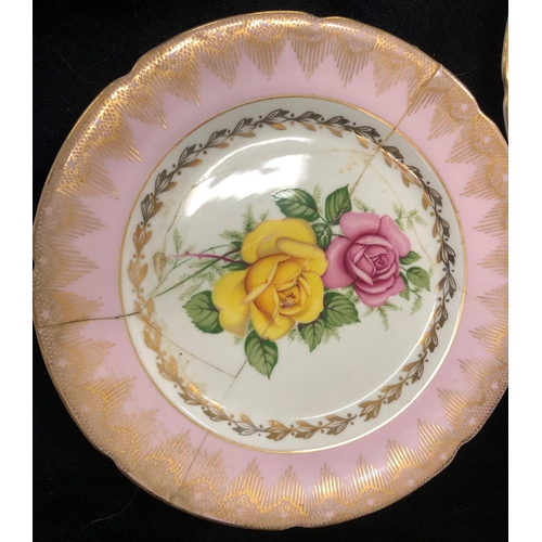 2084 - An Imperial rose patterned bone china part service, 6 cups, 5 saucers, sugar bowl, 5 side plates, 1 ... 