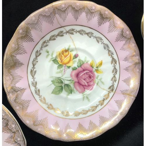 2084 - An Imperial rose patterned bone china part service, 6 cups, 5 saucers, sugar bowl, 5 side plates, 1 ... 