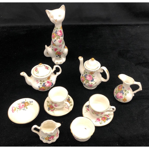 2090 - A pair of Imari patterned cups and saucers, a Noritake small jug, a Chelson china miniature tea set ... 