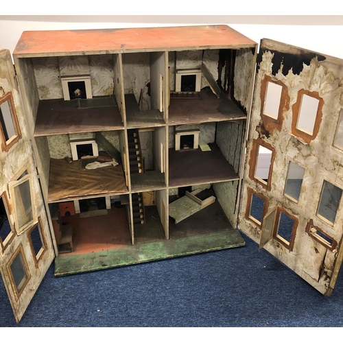 2094 - A large 19/20th Century dolls house with 2 hinged opening doors enclosing 3 floors, 92 wide, 52 deep... 