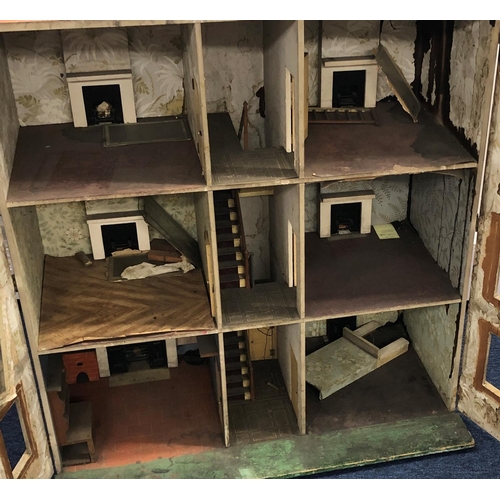 2094 - A large 19/20th Century dolls house with 2 hinged opening doors enclosing 3 floors, 92 wide, 52 deep... 