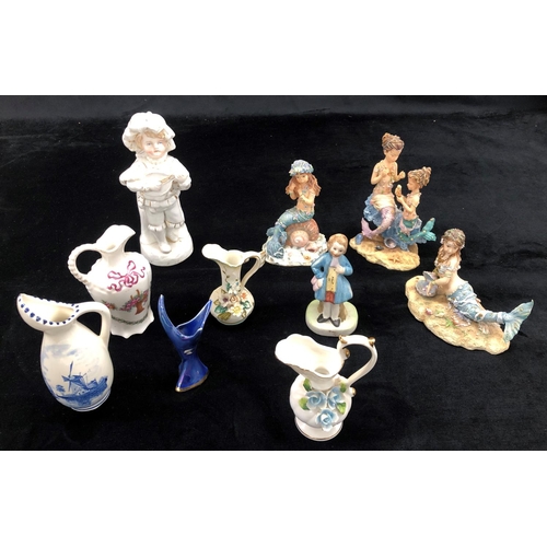 2100 - 3 limited edition Dream Time mermaids, a small Delft jug and various other small jugs and figurines.