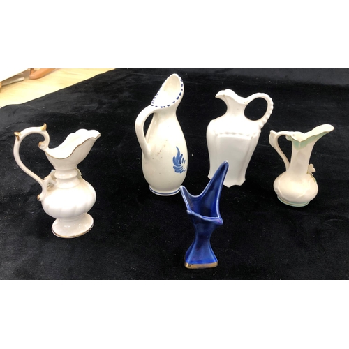 2100 - 3 limited edition Dream Time mermaids, a small Delft jug and various other small jugs and figurines.