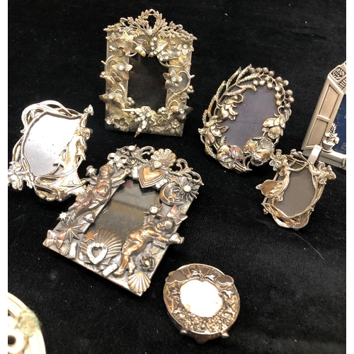 2103 - 3 miniature silver plated 5cm x 5cm photograph frames and various other miniature frames etc.