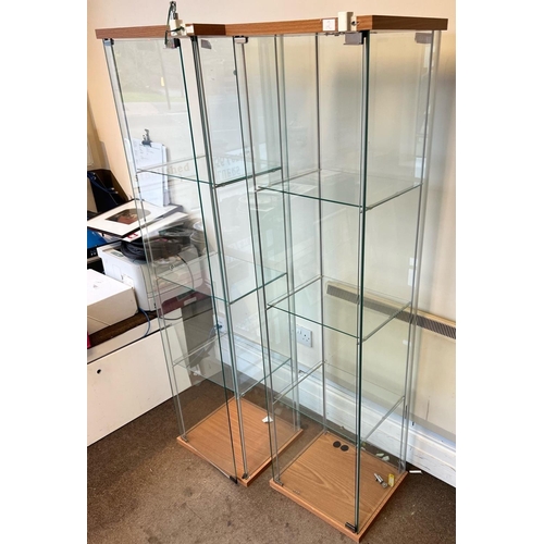 2149 - A pair of modern glass display cabinets with glass shelves, locks, hole to top of 1 cabinet for ligh... 