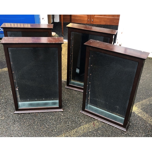 2150 - A set of 4 reproduction mahogany hanging display cabinets with hinged glass doors enclosing glass sh... 