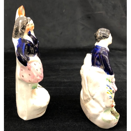 2156 - A pair of Victorian Staffordshire figures, tallest 17cm high.