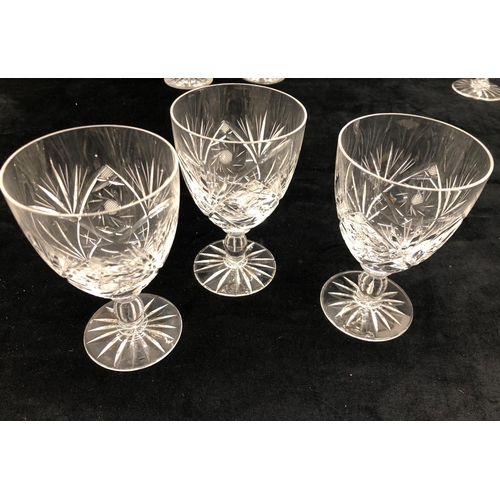 2162 - A cut glass decanter, a scent bottle  5 large wine glasses, and various other glasses.