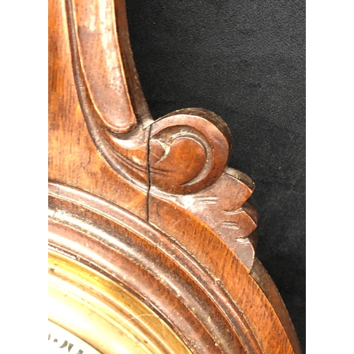 2169 - A Victorian oak aneroid wall barometer 92.5cm high including brass hanging fitting.