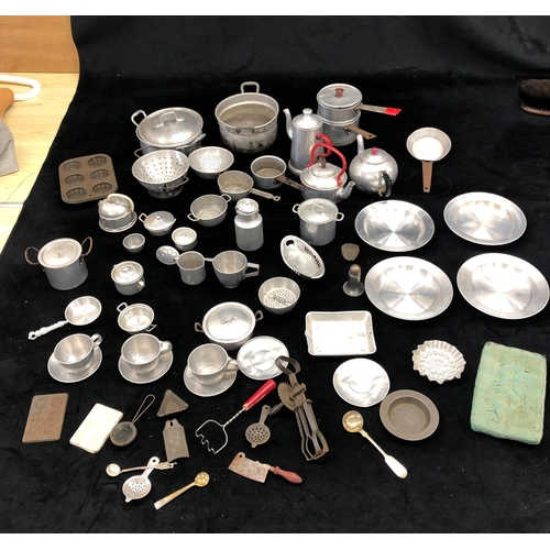 2181 - A large quantity of aluminium toy kitchen pots and pans and various other toy kitchen items, some st... 