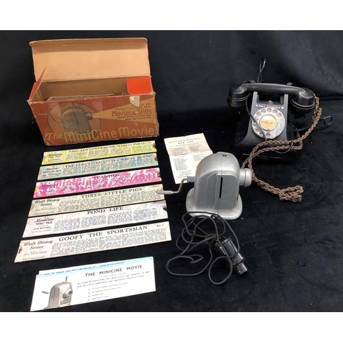 2185 - A Mini Cine movie projector, boxed with 6 films etc and a vintage black Bakelite telephone.