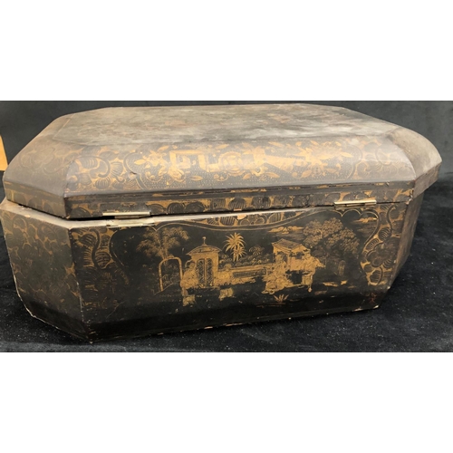 2194 - An Oriental black lacquered sewing box with hinged lid enclosing inner compartments.