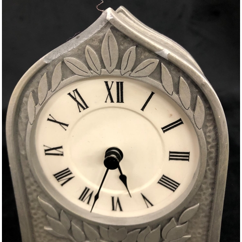 2196 - A small Arts & Crafts style clock, 19cm high.