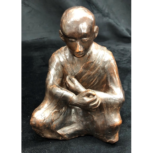 2198 - A clay figure of a seated man and a quantity of small glazed pots etc.