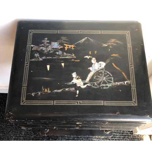 2205 - A circa 19th century black lacquered sewing table, decorated with Oriental scenes, with hinged lid e... 