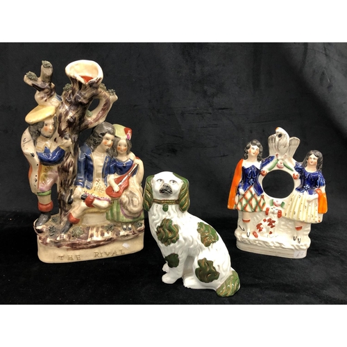 2212 - A small Staffordshire dog, 15cm high, a Staffordshire group of 2 girls with hole for clock (damaged)... 