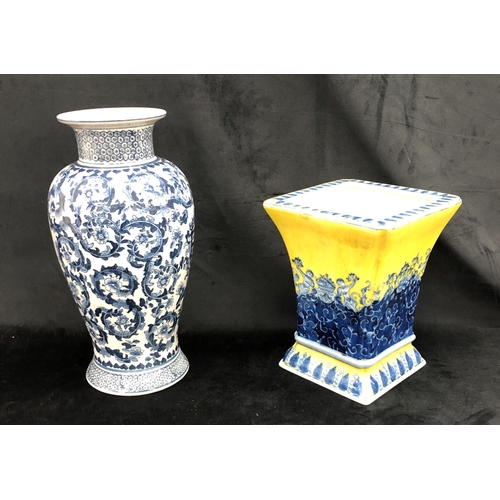 2213 - A reproduction blue and white vase 37cm high and a reproduction blue and yellow vase 25cm high.