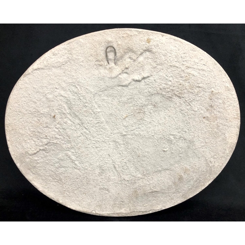 2218 - A heavy stone effect oval plaque depicting a lion and cherubs, 59cm x 49cm.