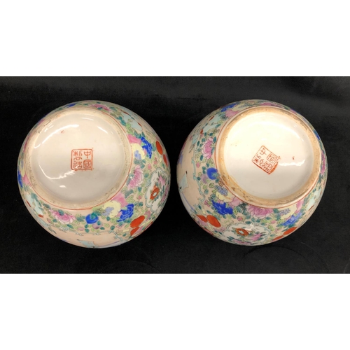 2240 - A pair of Oriental vases 18cm high and 4 Chinese plates 23cm diameter.