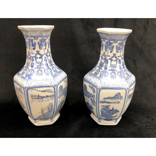 2242 - A pair of blue and white Oriental vases, 36cm high.