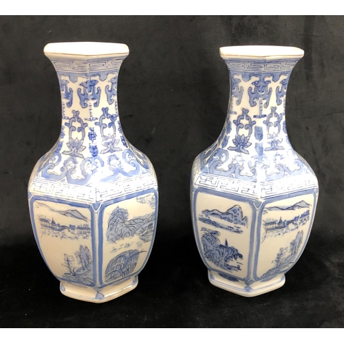 2242 - A pair of blue and white Oriental vases, 36cm high.