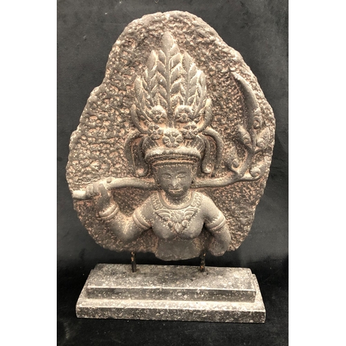 2249 - An Eastern stone effect figure on stone base, 25.5cm wide, 39.5cm high overall.