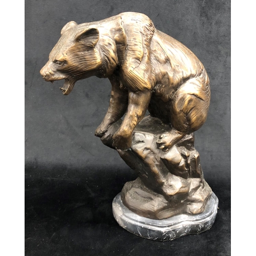 2255 - A heavy bronze figure of a roaring bear on marble base,  35cm high overall.