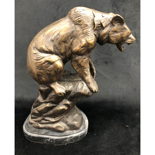 2255 - A heavy bronze figure of a roaring bear on marble base,  35cm high overall.