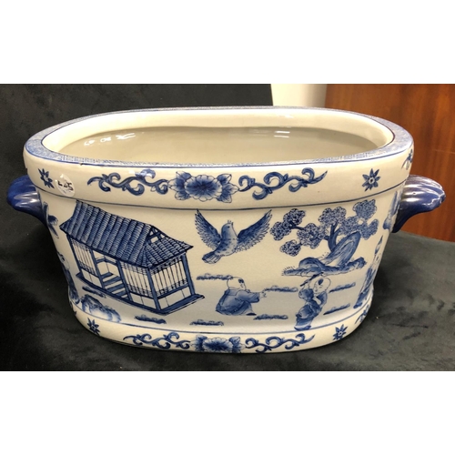 2261 - An Oriental blue and white rectangular jardiniere, 45cm wide, 26cm deep, 17.5cm high, a blue and whi... 