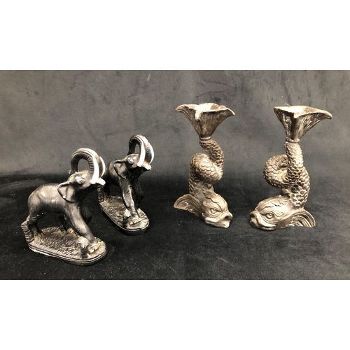 2278 - A pair of bronze Koi fish candlesticks, 18cm high and a pair of composition elephants, 15cm high ove... 