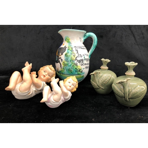 2291 - A pair of small green glazed vases with stoppers 10cm high, 2 Continental figures of cherubs and a S... 